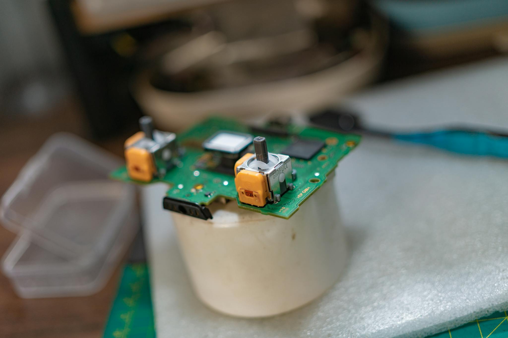 Detailed view of a green circuit board with electronic components.